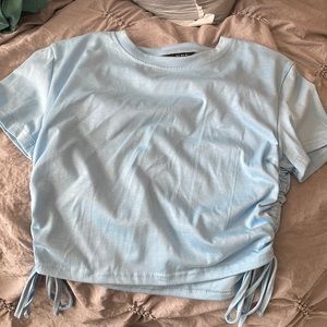 Light blue tshirt with scrunchie tie sides
